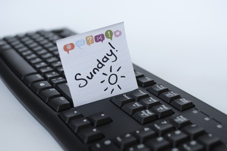 Days of the week written marker on the sticker are on the keyboard Stock Photo