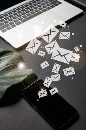 Smartphone with blank screen and email icons