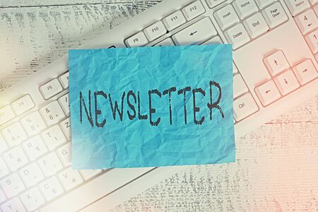 Text sign showing newsletter business photo text the bulletin was given to members of a company regularly white keyboard office supplies empty rectangle shaped paper reminder wood