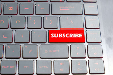 A picture of keyboard with the word subscribe for social media channel