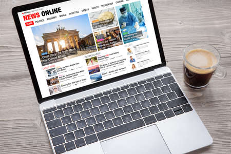 Sample news website opened on laptop s screen all contents on website are completely made up