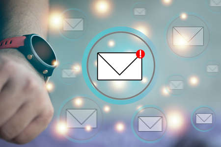 A smartwatch on hand and show important mail applications the concept of checking messages with a smart watch s app Stock Photo