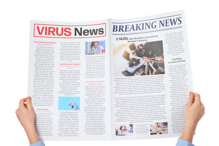 Female hands and newspaper on white background