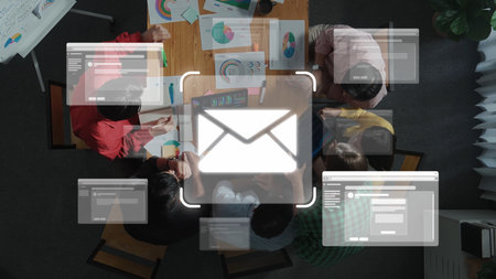 Aerial view of a collaborative team meeting focused on digital marketing strategies featuring email icons and analysis charts showcasing teamwork and creativity raster Stock Photo