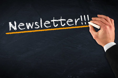 Chalkboard with hand and newsletter drawing