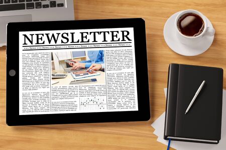 Online newsletter on tablet computer on a desktop 3d rendering Stock Photo
