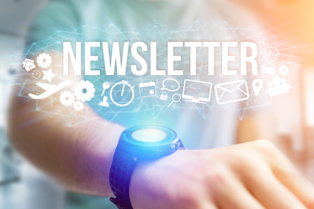Concept view of man holding futuristic interface with newsletter title and multimedia icons flying all around internet concept Stock Photo