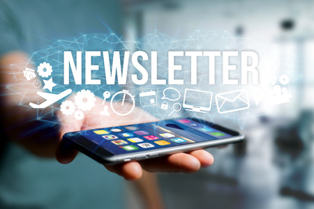 Concept view of man holding futuristic interface with newsletter title and multimedia icons flying all around internet concept