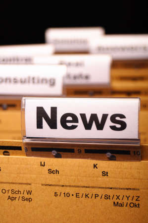 News or newsletter concept with word on folder register in business office